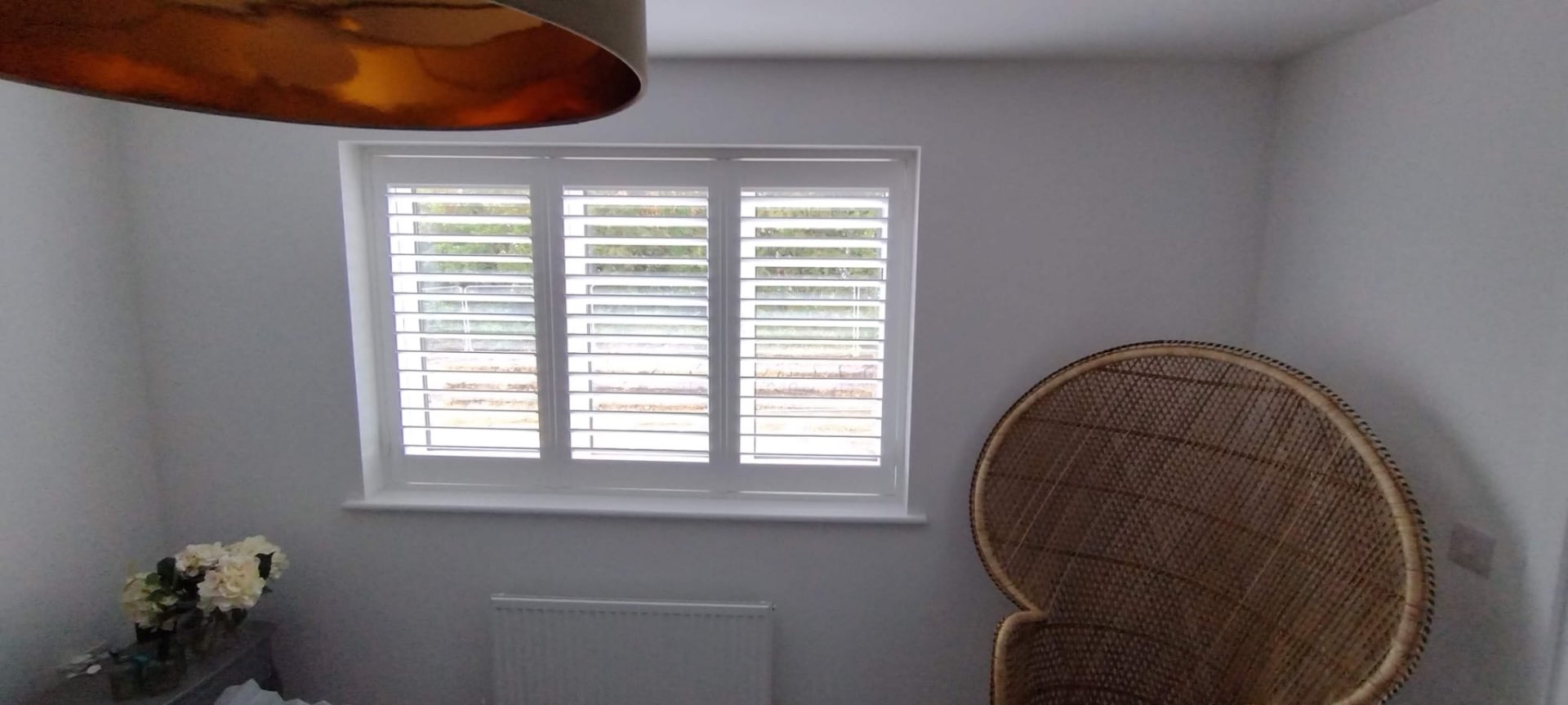 Café-style white shutters in a snug
